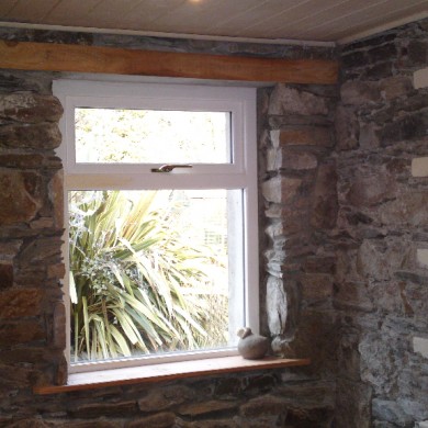 Ken O'Brien Carpentry and Building - Wood window cut into stone wall