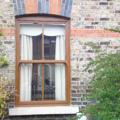 Ken O'Brien Carpentry and Building - Woodgrain up and down sash window